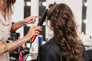 female-hairdresser-makes-bride-hairstyle-scaled