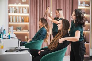 hairdresser-curling-woman-hair-beauty-salon